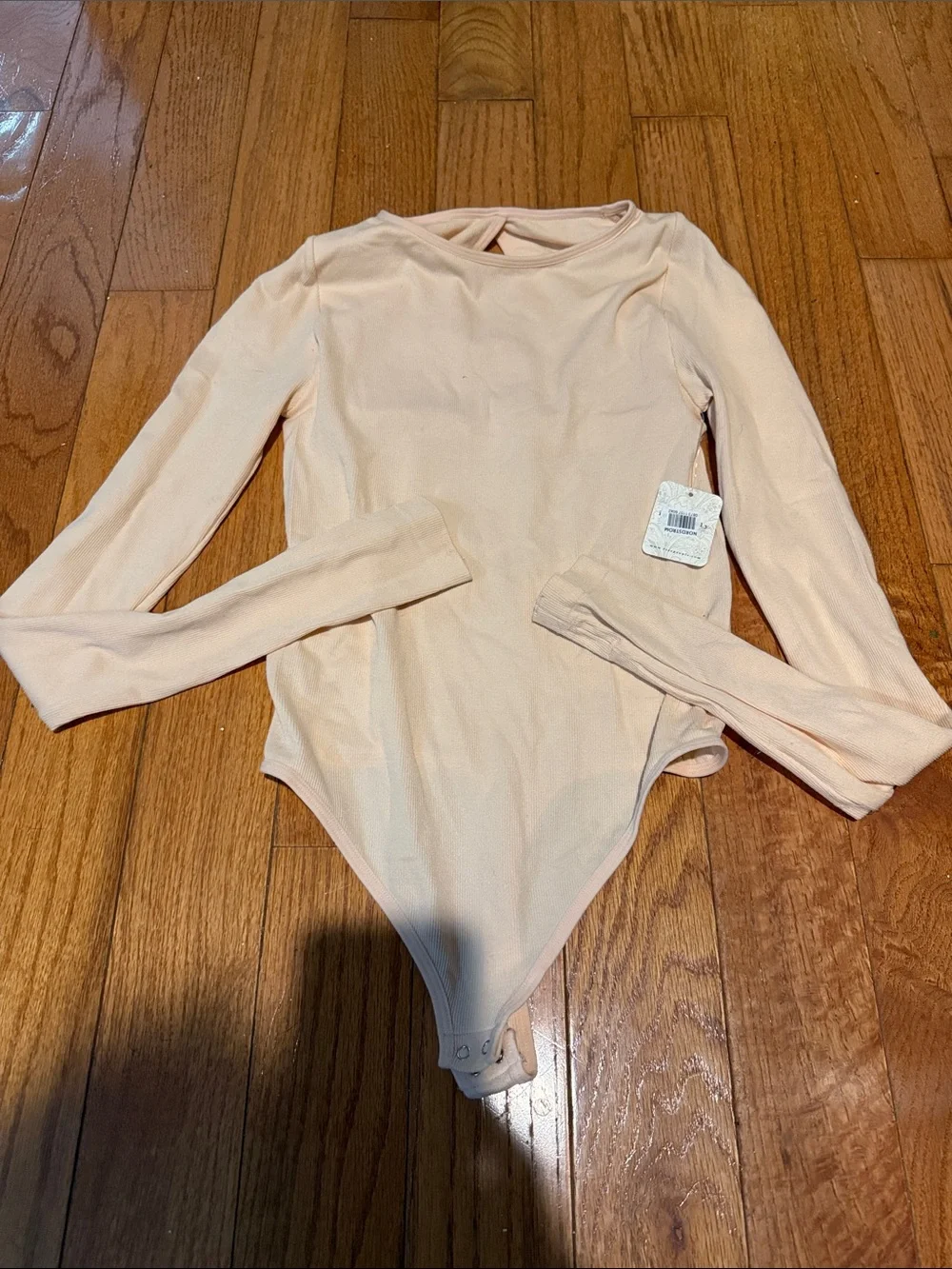Free People Long-Sleeve One-Piece Bodysuit in Light Peach